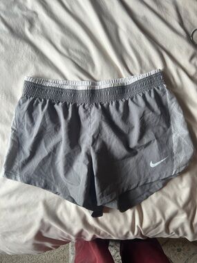 Nike Grey Athletic Running Shorts with White Swoosh